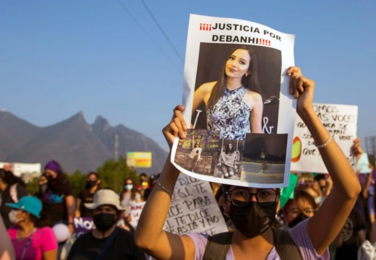 A protester holds a picture of 18-year-old student Debanhi Escobar whose death in northern Mexico has triggered outcry