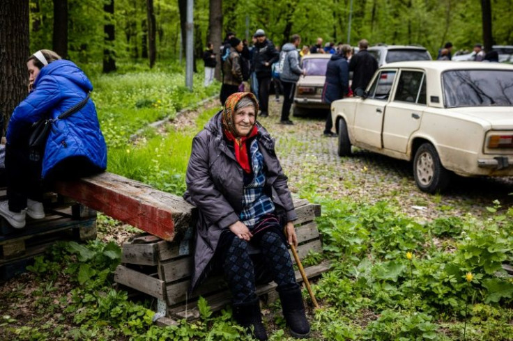 Several hundred people evacuated the village of Ruska Lozova, north of Ukraine's second city Kharkiv, after it was freed by the Ukrainian army