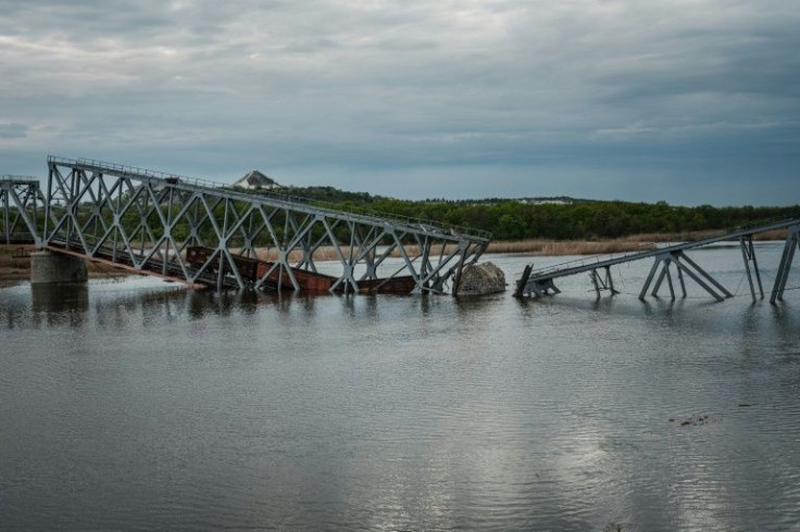 A destroyed railway bridge over the Siverskyi Donets river
