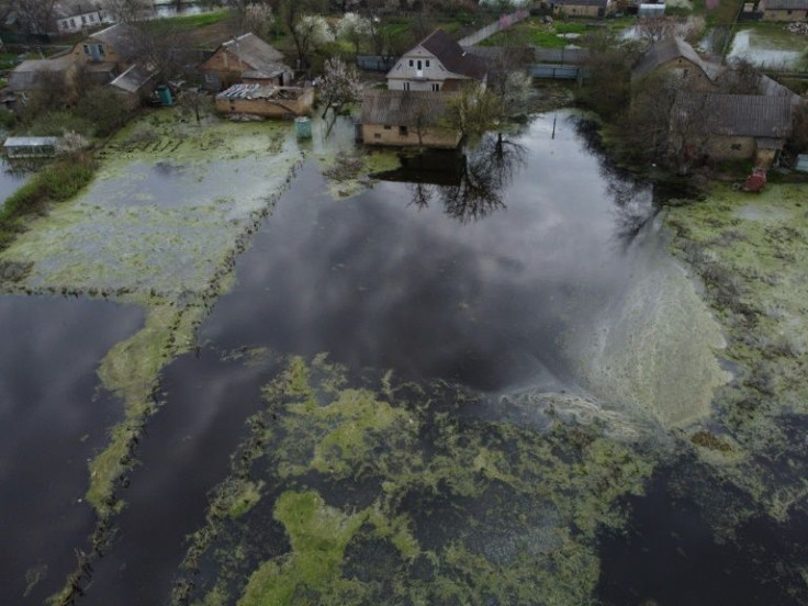 Getting rid of all the floodwater and drying out the homes in the small Ukrainian town of Demydiv looks set to be weeks away