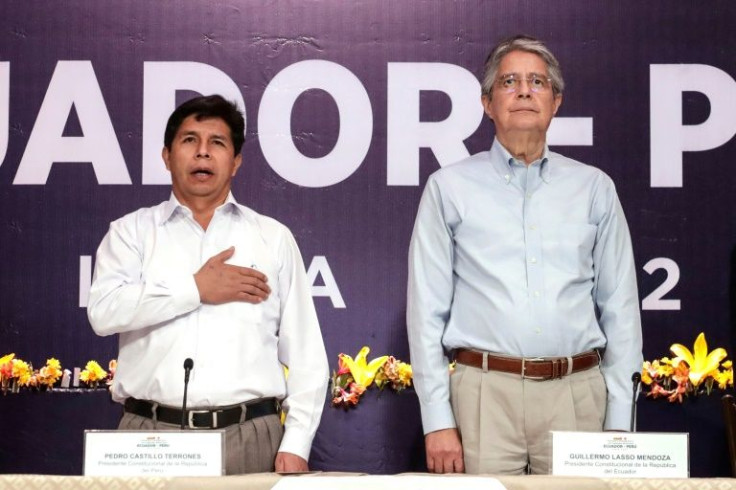 Handout picture released by the Peruvian Presidency of President Pedro Castillo (L) and his Ecuadorian counterpart Guillermo Lasso during a Binational Peru-Ecuador Cabinet Meeting in Loja, Ecuador, on April 29, 2022