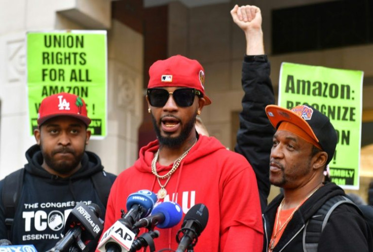 Christian Smalls (C) celebrates after workers voted to form a union at the Amazon sorting warehouse in New York on April 1, 2022