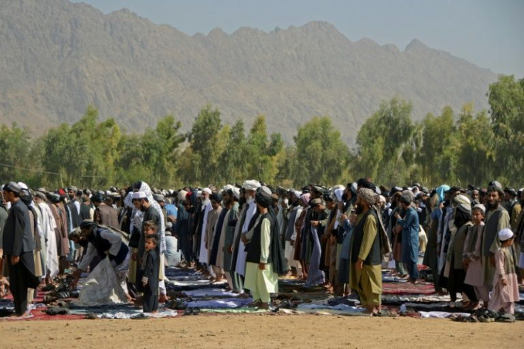 Muslim devotees offer Eid al-Fitr prayers, which marks the end of the holy fasting month of Ramadan at Eidgah in Kandahar