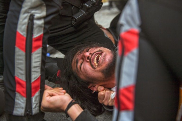 Turkish protests were pinned to the ground and dragged away from the rally in Istanbul