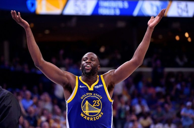 Golden State's Draymond Green reacts to being ejected on Sunday for a flagrant foul but the Warriors managed to defeat host Memphis 117-116 in an NBA playoff game on Sunday