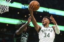 Milwaukee's Giannis Antetokounmpo drives to the basket past Boston's Robert Williams in the Bucks' 101-89 NBA playoff series-opening win over the Celtics