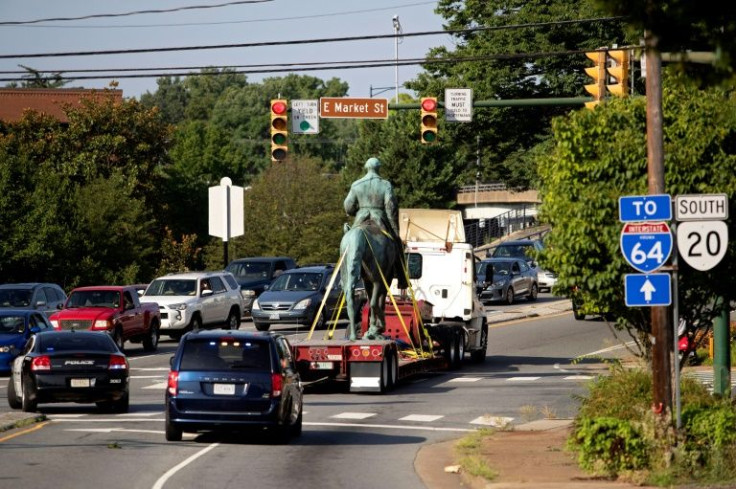 A truck takes away the statue of Confederate general Robert E Lee, in July 2021 in Charlottesville, Virginia