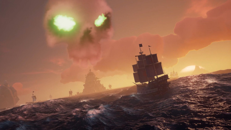 Ships sailing towards an active skeleton fort in Sea of Thieves