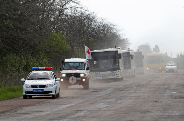 A bus convoy carrying civilians from Mariupol, including evacuees from Azovstal steel plant, is seen on a road on the way to Zaporizhzhia, during Ukraine-Russia conflict in the Donetsk Region, Ukraine May 2, 2022. 