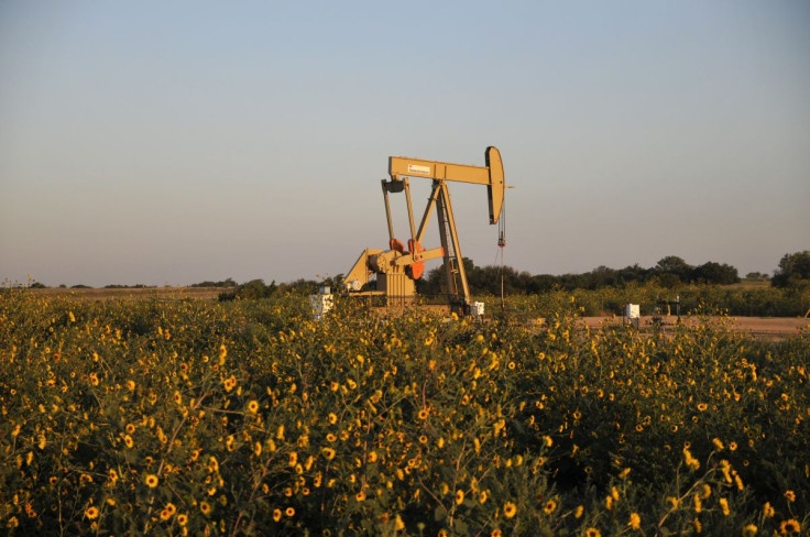 A pump jack operates at a well site leased by Devon Energy Production Company near Guthrie, Oklahoma September 15, 2015.