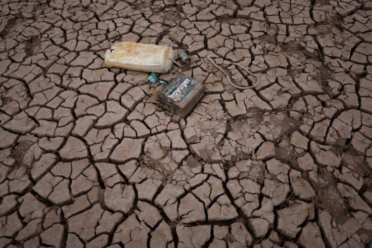 Lake and reservoir beds usually under water are being exposed across the western US as a historic drought takes its toll on water supplies