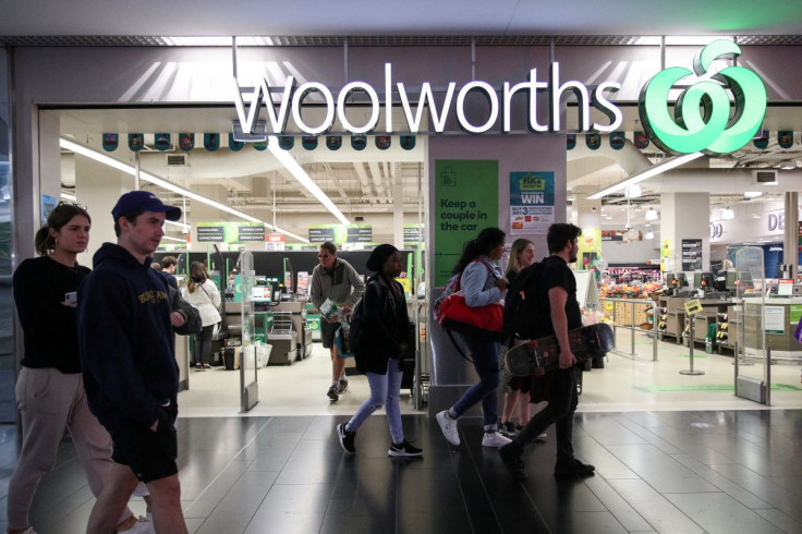 People walk past a Woolworths supermarket following the easing of restrictions implemented to curb the spread of the coronavirus disease (COVID-19) in Sydney, Australia, June 16, 2020.