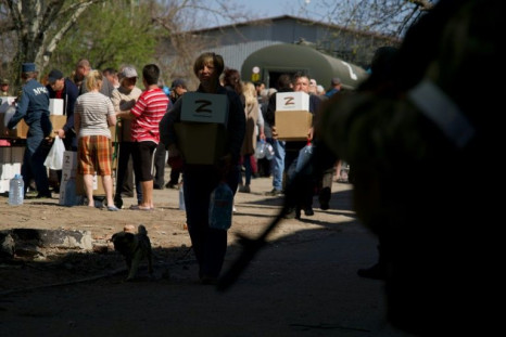 Aid packages distributed in Mariupol are marked with the 'Z' symbol of support for Russia's military campaign in Ukraine