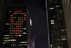 The female gender symbol is seen displayed on the Ernst and Young Building on International Women's Day in Times Square in New York City, New York, U.S., March 8, 2018. 