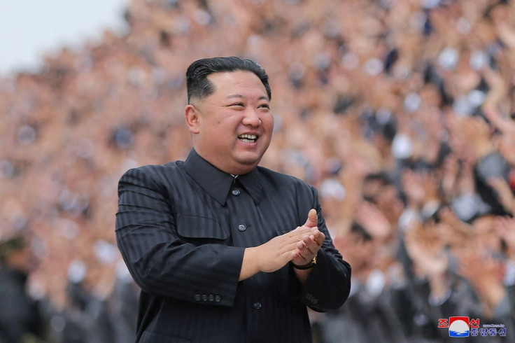 North Korean leader Kim Jong Un applauds during a photo session with students and young workers in Pyongyang, North Korea, in this undated photo released by North Korea's Korean Central News Agency (KCNA) on May 1, 2022. KCNA via REUTERS