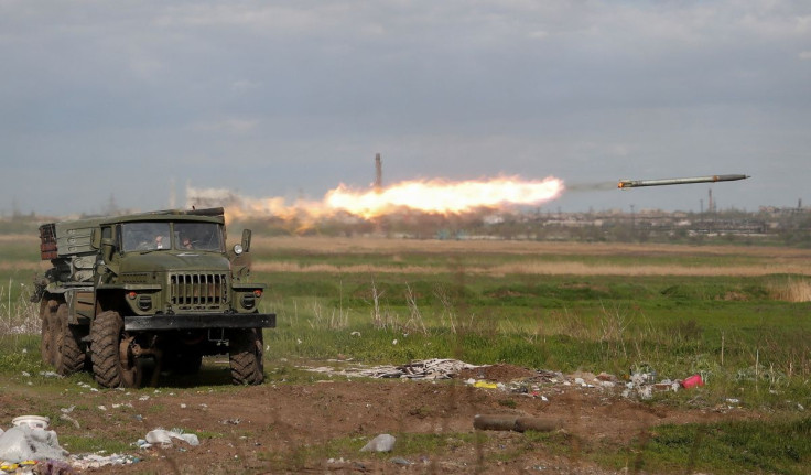 Service members of pro-Russian troops fire a BM-21 Grad multiple rocket launch system during fighting in Ukraine-Russia conflict near a plant of Azovstal Iron and Steel Works in the southern port city of Mariupol, Ukraine May 2, 2022. 