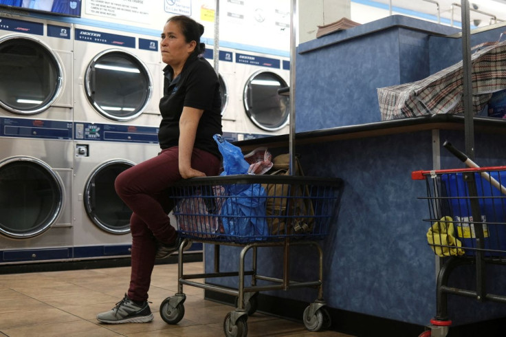 Maria Hernandez, 54, waits at a laundromat in downtown Los Angeles, after reunification with her two daughters with whom she was separated under a controversial Trump administration policy in 2017, in Los Angeles, California, U.S., April 6, 2022.