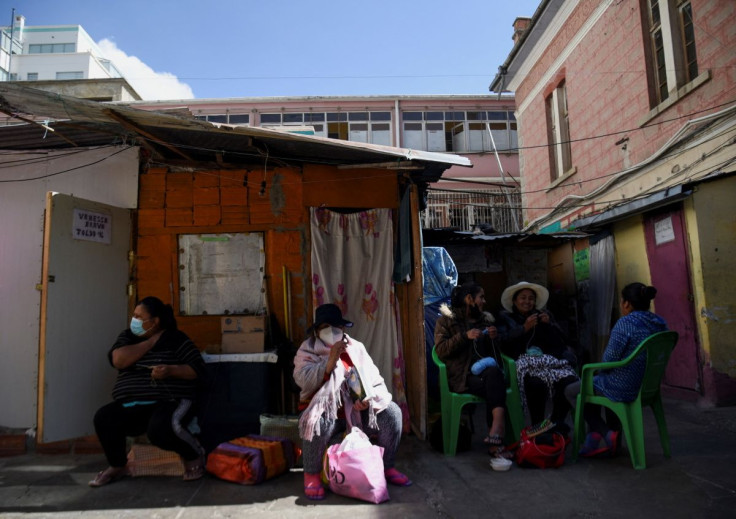 Inmates sit together at a prison that offers access to a small library as part of a program that aims to spread literacy and offer the chance to get out of jail earlier, in La Paz, Bolivia April 29, 2022.