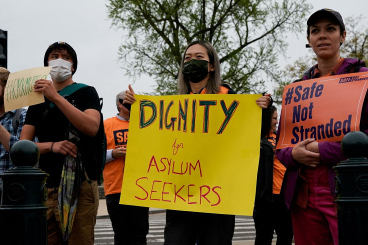 People in support of rights for asylum seekers rally as the U.S. Supreme Court hears oral arguments in President Joe Biden's bid to rescind a Trump-era immigration policy that forced migrants to stay in Mexico to await U.S. hearings on their asylum claims