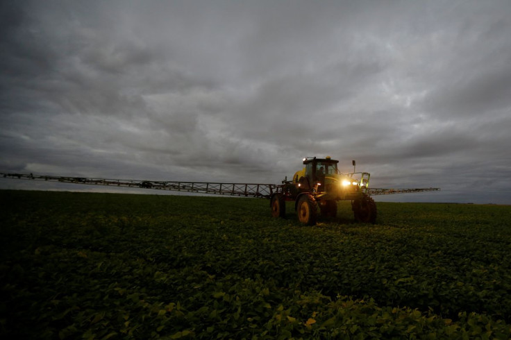 A farmer works with his tractor on a field near Brasilia, Brazil, August 6, 2019.