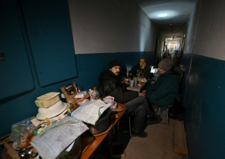 Ukrainian teacher Tetyana Sobistiyanska lives in the dark hallway of a building partially destroyed by the Russians in March