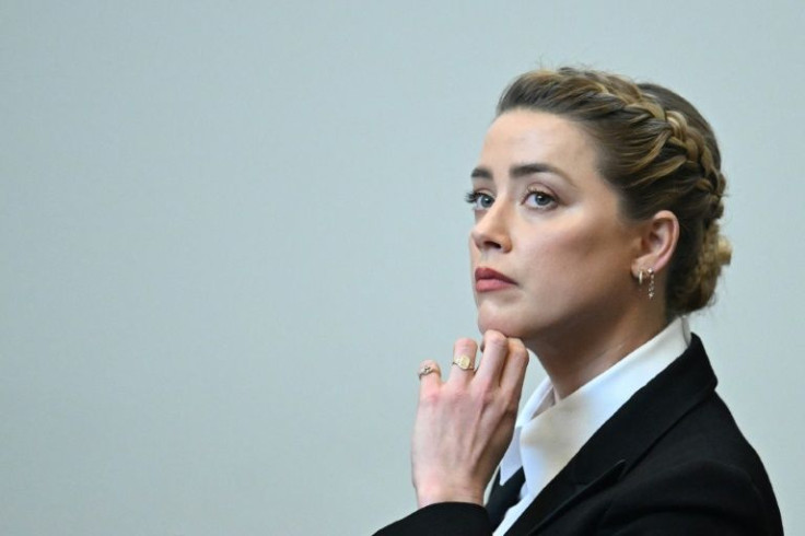 Actress Amber Heard listens to testimony in the defamation case filed against her by her ex-husband Johnny Depp