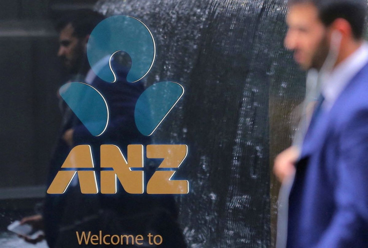A pedestrian is reflected in the window of a branch of the Australia and New Zealand Banking Group (ANZ) in central Sydney, Australia, October 25, 2017. Picture taken October 25, 2017.