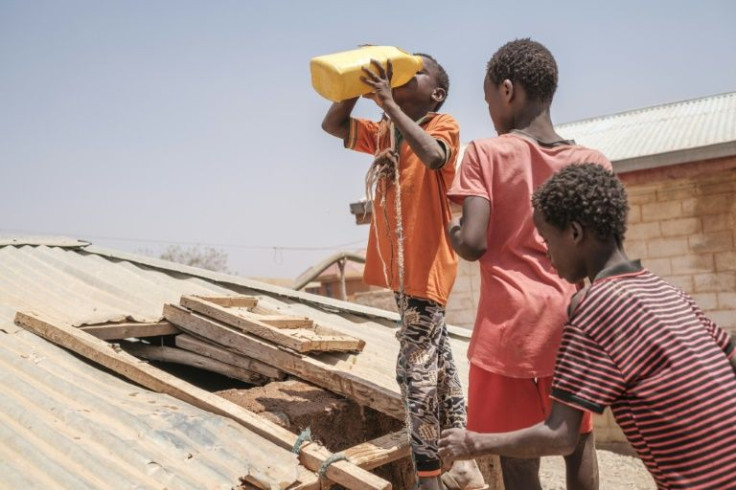 Thirst: Children queue to drink water at a cistern in the village of Adlale near Gode, Ethiopia