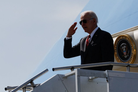 U.S. President Joe Biden salutes as he boards Air Force One to return to Washington from Maxwell Air Force Base in Montgomery, Alabama, U.S. May 3, 2022. 
