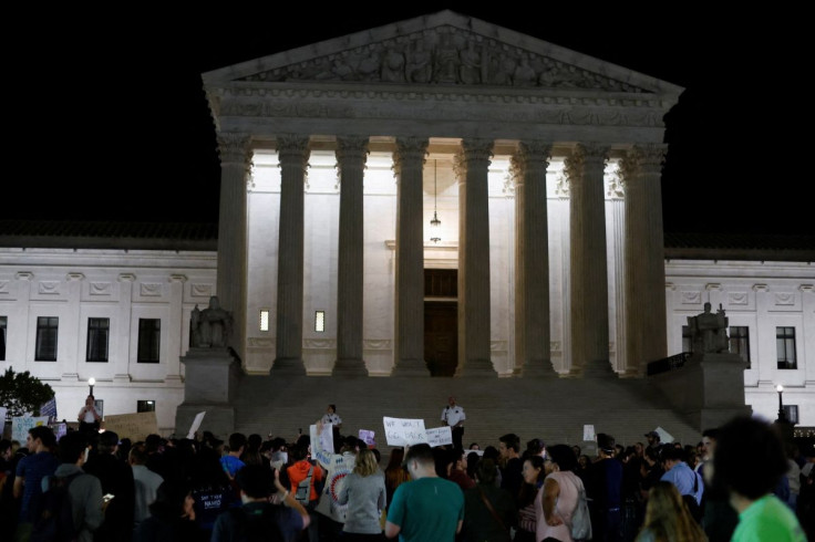 Protestors react outside the U.S. Supreme Court to the leak of a draft majority opinion written by Justice Samuel Alito preparing for a majority of the court to overturn the landmark Roe v. Wade abortion rights decision later this year, in Washington, U.S