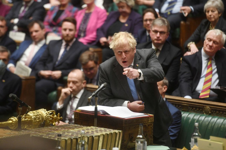 British Prime Minister Boris Johnson points across the floor during Prime Minister's Questions at the House of Commons in London, Britain April 27, 2022. UK Parliament/Jessica Taylor/Handout via REUTERS