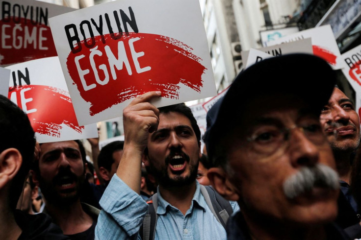People take part in a protest against a Turkish court decision that sentenced philanthropist Osman Kavala to life in prison over trying to overthrow the government in Istanbul, Turkey, April 26, 2022.