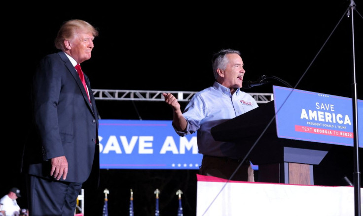 Congressman Jody Hice (R-GA), who is currently running for Georgia Secretary of State, is seen on stage with former U.S. President Donald Trump during a rally in Perry, Georgia, U.S. September 25, 2021. 