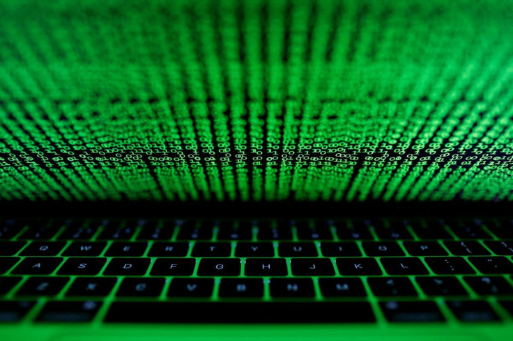 A computer keyboard lit by a displayed cyber code is seen in this illustration picture taken on March 1,  2017. 