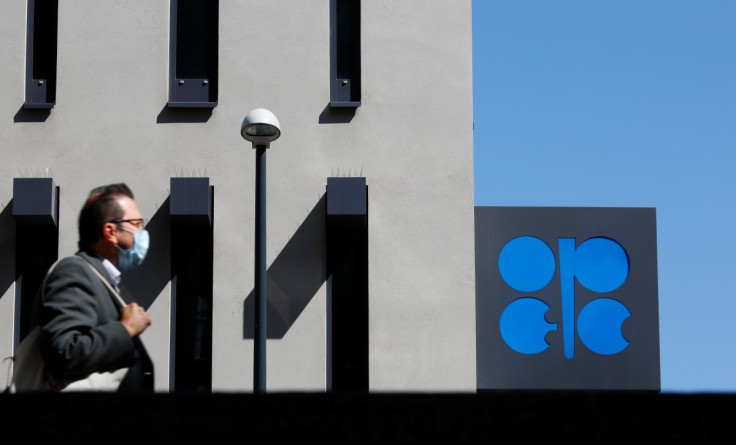 A person passes the logo of the Organization of the Petroleoum Exporting Countries (OPEC) in front of OPEC's headquarters in Vienna, Austria April 9, 2020.  
