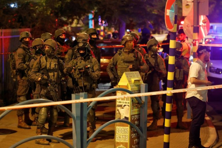 Israeli security forces are pictured at the scene of an attack in the central city of Elad on May 5