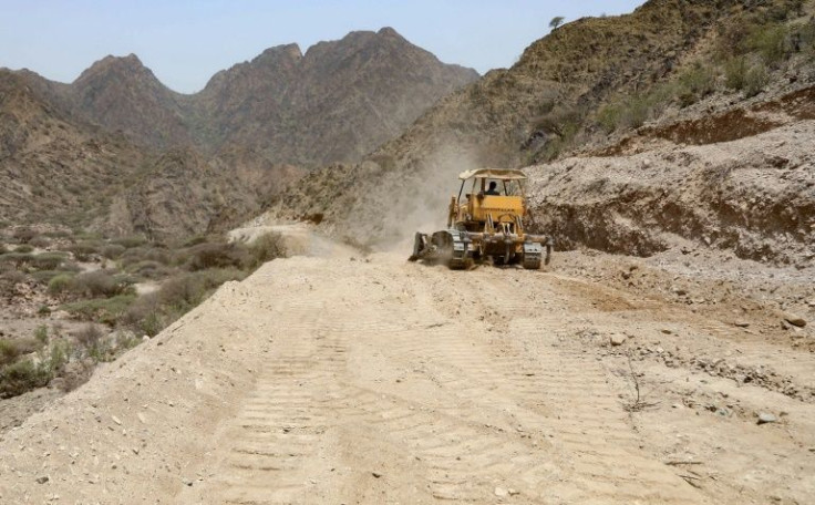 A bulldozer operates in the mountains near Yemen's third city of Taez