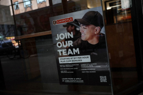 A sign for hire is posted on the window of a Chipolte Restaurant in New York City, U.S., April 29, 2022. 