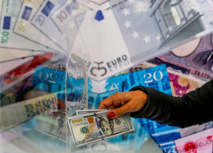 A money changer sells U.S. dollar bills at a currency exchange office in Ankara, Turkey September 24, 2021.