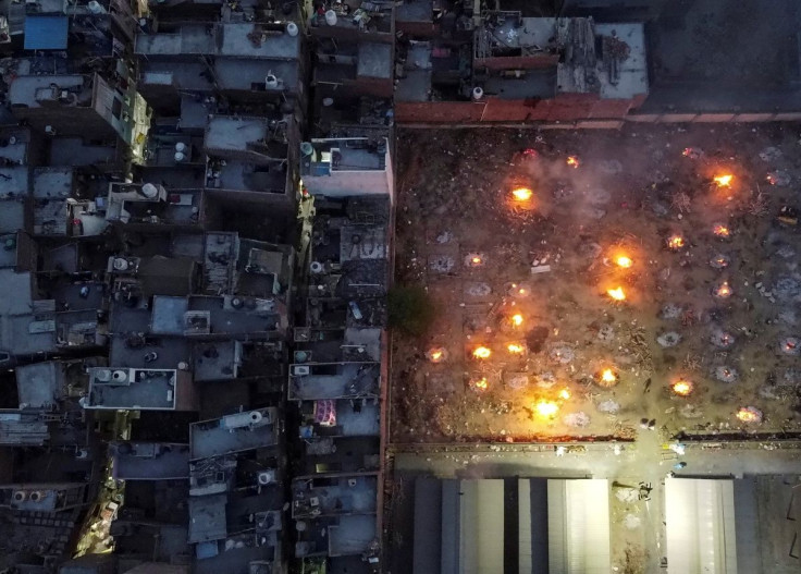 A mass cremation of victims who died from complications related to the coronavirus disease (COVID-19), is seen at a crematorium ground in New Delhi, India, April 22, 2021. Picture taken with a drone.