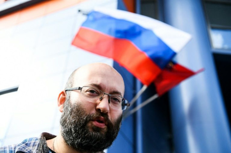 Reporter and municipal deputy Ilya Azar has left Russia and said he is now living in an EU country