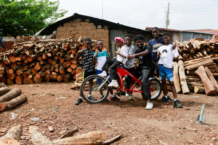 Joshua Anum, who had his left arm amputated 7 years ago, poses for a picture with other members of "The Incredible Kids" dance group after a rehearsal, in Abuja, Nigeria April 30, 2022.