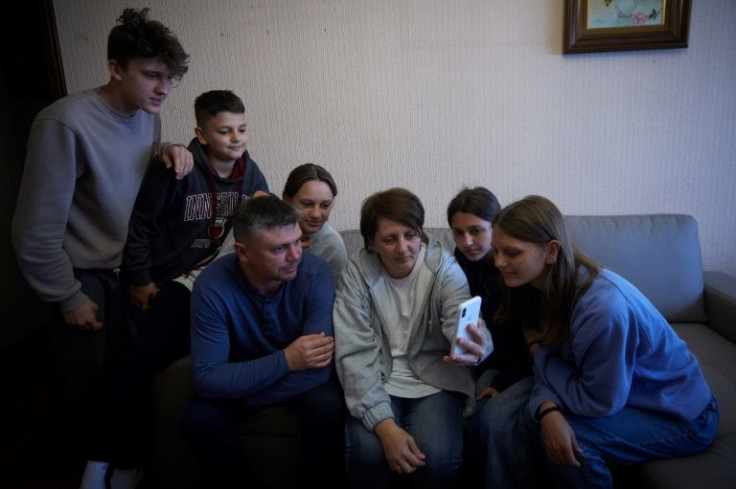 The Pavlosky family make a video call from Spain to their son Xenia, who had to stay behind in Ukraine