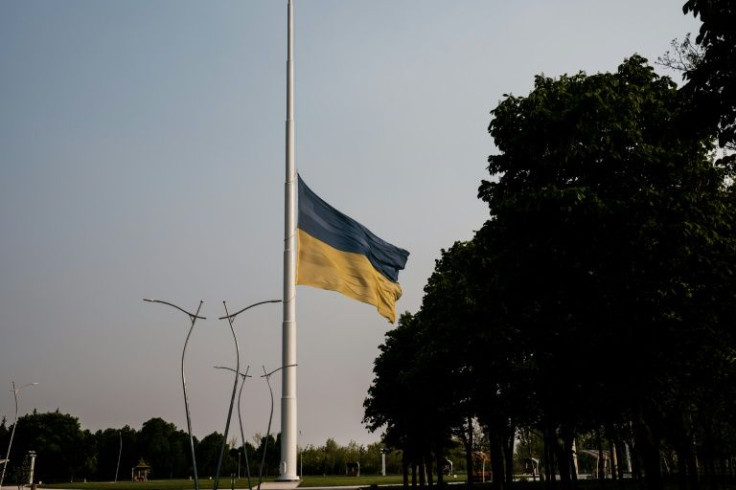 A giant national flag overlooking Kramatorsk has been lowered in mourning for the victims of the missile strikes