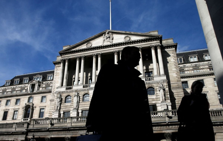 Pedestrians walk past the Bank of England in London March 5, 2015.