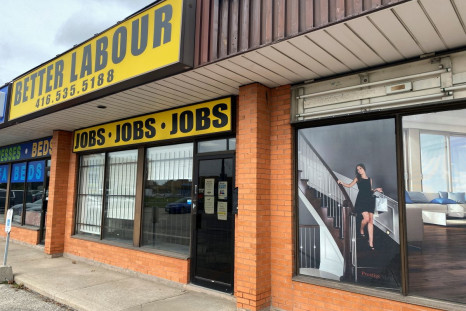 A view of an illustration outside a wood flooring sales office next to an employment agency in Toronto, Ontario, Canada October 8, 2021. 