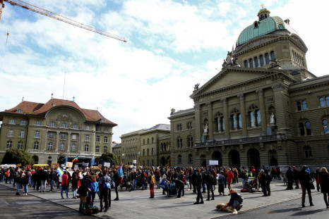 Protestors gather as they take part in the Global Climate Strike of the movement Fridays for Future in front of the Bundeshaus, the seat of the Swiss federal parliament and the building of the Swiss National Bank (SNB) at the Bundesplatz square in Bern, S