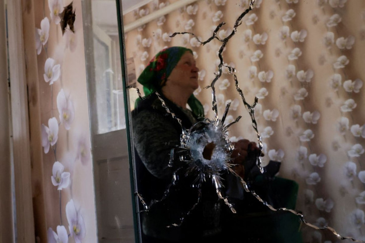 Kateryna Golovachuk, 65, reacts as she shows her house that according to her was damaged by shelling, amid the Russian invasion of Ukraine, in Novotavrycheske village, Zaporizhzhia region, Ukraine May 6, 2022. 