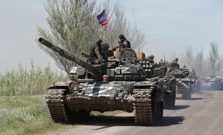 Service members of pro-Russian troops drive armoured vehicles during Ukraine-Russia conflict near Novoazovsk in the Donetsk Region, Ukraine May 6, 2022. 