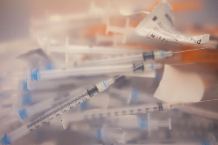 Syringes used to administer doses of the Pfizer-BioNTech vaccine against the coronavirus disease (COVID-19) are pictured in a sharps container at a booster clinic for 12 to 17-year-olds in Lansdale, Pennsylvania, U.S., January 9, 2022. 